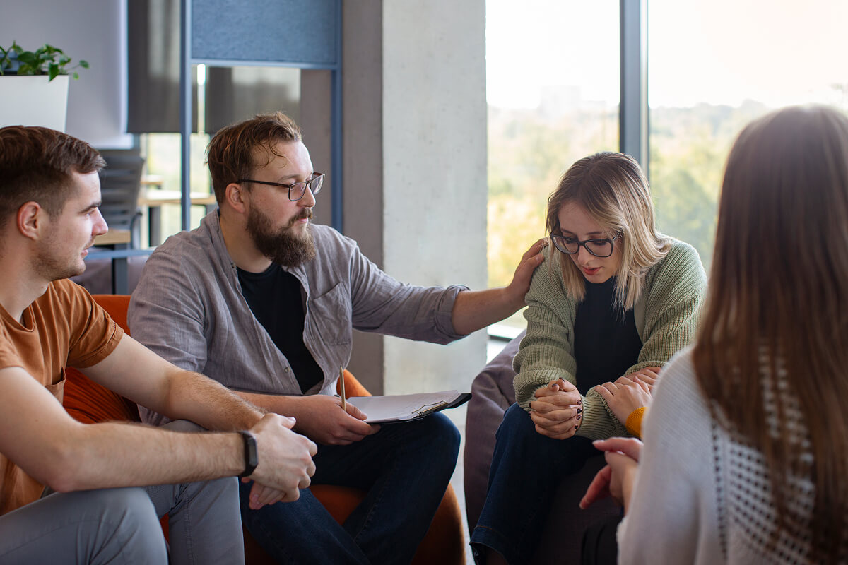 People talking together in a supportive group setting
